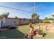 Landscaped backyard with decorative pots and fire pit at 910 S Portland Cir, Mesa, AZ 85206