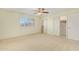 Bedroom with carpet, ceiling fan and large closet at 910 S Portland Cir, Mesa, AZ 85206