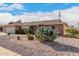 Brick ranch house with cactus landscaping and two-car garage at 910 S Portland Cir, Mesa, AZ 85206