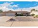 Brick ranch house with landscaped yard, two-car garage, and driveway at 910 S Portland Cir, Mesa, AZ 85206