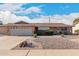 Brick ranch house with landscaped yard, two-car garage, and driveway at 910 S Portland Cir, Mesa, AZ 85206