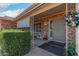 Brick front porch with decorative metal door and holiday wreath at 910 S Portland Cir, Mesa, AZ 85206