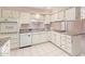 View of kitchen with white cabinets and granite counters at 910 S Portland Cir, Mesa, AZ 85206