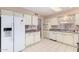 Kitchen with white cabinets, granite counters and appliances at 910 S Portland Cir, Mesa, AZ 85206