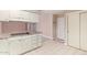 Kitchen area with white cabinets and tile floor at 910 S Portland Cir, Mesa, AZ 85206