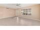 Bright living room with tile flooring and ceiling fan at 910 S Portland Cir, Mesa, AZ 85206