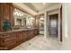 Elegant Primary bathroom with double vanity and dark wood cabinets at 9108 N Fireridge Trl, Fountain Hills, AZ 85268