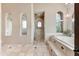 Spa-like bathroom with soaking tub, shower, and neutral tile flooring at 9108 N Fireridge Trl, Fountain Hills, AZ 85268