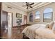 Bright bedroom with hardwood floors, fireplace, and ensuite bathroom access at 9108 N Fireridge Trl, Fountain Hills, AZ 85268