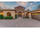 Elegant entryway with arched entry and ornate iron door at 9108 N Fireridge Trl, Fountain Hills, AZ 85268