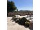 Outdoor kitchen, fire pit, and seating area with desert landscaping at 9697 E Preserve Way, Scottsdale, AZ 85262