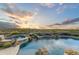 Expansive pool and spa with a waterfall feature and breathtaking mountain views at 9697 E Preserve Way, Scottsdale, AZ 85262