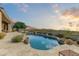 Luxury pool and spa with mountain views, spacious patio, and lush landscaping at 9697 E Preserve Way, Scottsdale, AZ 85262