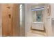 Modern bathroom with a large shower and floating vanity at 9821 E Sundance Trl, Scottsdale, AZ 85262