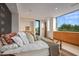 Serene bedroom with large window and custom wood accents at 9821 E Sundance Trl, Scottsdale, AZ 85262