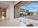 Grand entry with glass doors showcasing expansive backyard and mountain views at 9821 E Sundance Trl, Scottsdale, AZ 85262