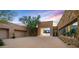 Home with a large courtyard and glass entryway at 9821 E Sundance Trl, Scottsdale, AZ 85262