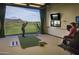 High-tech golf simulator room with large screen and multiple cameras at 9821 E Sundance Trl, Scottsdale, AZ 85262