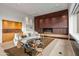 Modern living room with a built-in bar and fireplace at 9821 E Sundance Trl, Scottsdale, AZ 85262