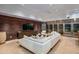 Modern lounge with wine storage and large TV at 9821 E Sundance Trl, Scottsdale, AZ 85262