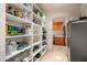 Well-organized pantry with ample shelving for storage at 9821 E Sundance Trl, Scottsdale, AZ 85262