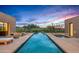 Long rectangular pool with fire pits on each side at 9821 E Sundance Trl, Scottsdale, AZ 85262