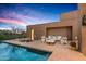 Luxury pool and patio area with fire pit and seating, perfect for outdoor entertaining at 9821 E Sundance Trl, Scottsdale, AZ 85262