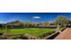 Luxury tennis court with mountain views and lush landscaping at 9821 E Sundance Trl, Scottsdale, AZ 85262