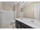 Bathroom with double vanity, tub, and shower at 9925 E Orange Grove St, Florence, AZ 85132