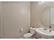 Clean bathroom with toilet, sink, and vanity at 9925 E Orange Grove St, Florence, AZ 85132