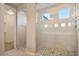 Spa-like bathroom with a large walk-in shower and tile surround at 9925 E Orange Grove St, Florence, AZ 85132