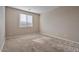 Well-lit bedroom with carpet and window coverings at 9925 E Orange Grove St, Florence, AZ 85132