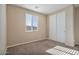 Spacious bedroom with double door closet and carpet at 9925 E Orange Grove St, Florence, AZ 85132