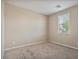 Simple bedroom with carpeted floors and a window at 9925 E Orange Grove St, Florence, AZ 85132