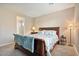 Serene bedroom with wood bed frame and ensuite bathroom access at 9925 E Orange Grove St, Florence, AZ 85132