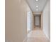 Bright hallway with tiled floors and neutral walls at 9925 E Orange Grove St, Florence, AZ 85132