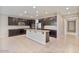 Modern kitchen with island, stainless steel appliances, and dark cabinetry at 9925 E Orange Grove St, Florence, AZ 85132