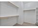 Spacious walk-in closet with ample shelving and hanging rods at 9925 E Orange Grove St, Florence, AZ 85132