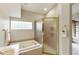 Bathroom with soaking tub, shower, and updated fixtures at 11111 E Elmhurst Dr, Sun Lakes, AZ 85248