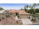 Single-story home with tile roof, desert landscaping, and two-car garage at 11111 E Elmhurst Dr, Sun Lakes, AZ 85248