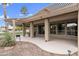 Large covered patio with seating area and desert landscape at 11111 E Elmhurst Dr, Sun Lakes, AZ 85248