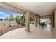 Covered patio with seating area and desert landscaping at 11111 E Elmhurst Dr, Sun Lakes, AZ 85248