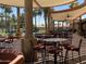 Large outdoor patio with tables and chairs under a pergola at 11111 E Elmhurst Dr, Sun Lakes, AZ 85248