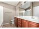 Double vanity bathroom with a large mirror and tile flooring at 1127 S 165Th Dr, Goodyear, AZ 85338