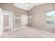 Well-lit bedroom featuring neutral walls and carpet at 1127 S 165Th Dr, Goodyear, AZ 85338