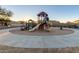 Community playground with playset and sand area at 1127 S 165Th Dr, Goodyear, AZ 85338