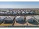 Aerial view of neighborhood with desert landscape and homes at 1130 W Avalon Canyon Dr, Casa Grande, AZ 85122