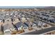 Aerial view of neighborhood showing new homes and streets at 1130 W Avalon Canyon Dr, Casa Grande, AZ 85122