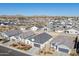 Aerial view of neighborhood showcasing new homes and desert landscape at 1130 W Avalon Canyon Dr, Casa Grande, AZ 85122