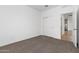 Well-lit bedroom featuring a large closet and view of kitchen at 1130 W Avalon Canyon Dr, Casa Grande, AZ 85122